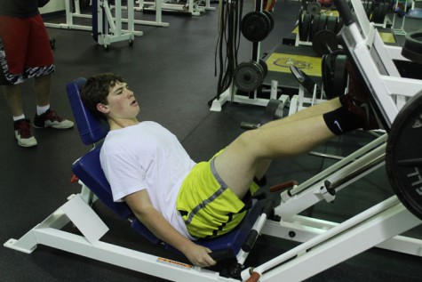 Josh Elliot working out in the weight room