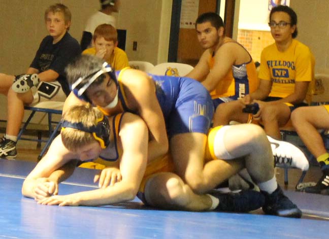 Sophomore Emilio Ramos and freshman Jake Hendren compete for the pin at the Blue & Gold Scrimmage.