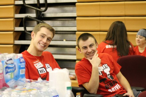 Senior Brian Kennedy, and Senior Jace Barker helping people out at the registration table. 