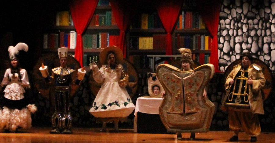 Seniors Angela Twidwell (Babette), Max Wohler (Lumiere), Hope Wilke (Mrs. Potts), Tiffany Hall (Dresser), and Christian Bartling (Cogsworth), perform Human Again as the palace household objects.