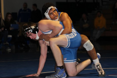Sophomore Braiden Ruffin prepares to take down his opponent.