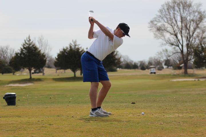 Sophomore Chesney Tatman winds up for his tee shot on the fourth hole at the Lake Maloney Golf Course on March 22nd. Tatman shot a par on this 168 yard par-3.