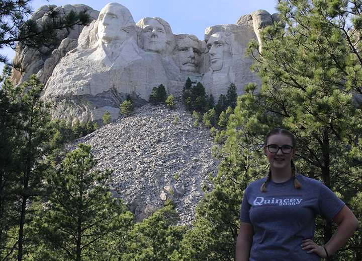 Sophomore Quincey Epley poses with presidents past in her hopeful family vacation at Mt. Rushmore in South Dakota this fall.