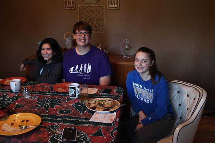 Juniors Allison Brogdon, Zac Oschner, and Nirvana Mendoza gather around the table. for their all vegan and gluten-free Thanksgiving dinner. They said they loved every bite.