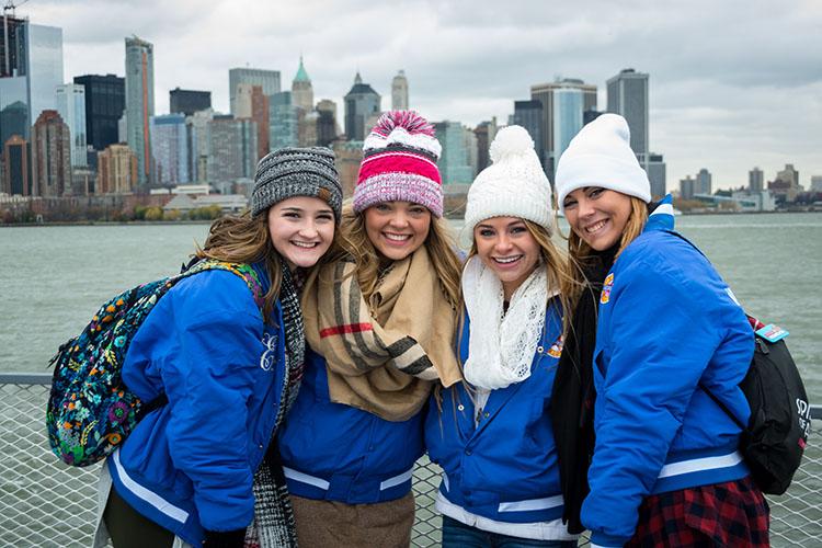 Libsack poses with other cheerleaders on their tour of Ellis Island.