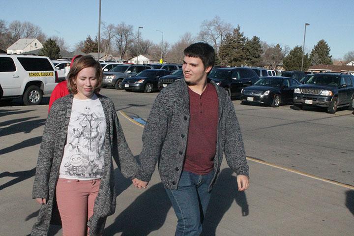 Junior Samuel Brumfield and sophomore Jessica Renfrow are seen walking into the school holding hands, a form of PDA. “It’s not too far. That one I am okay  with,” said junior Nirvana 	Mendoza.