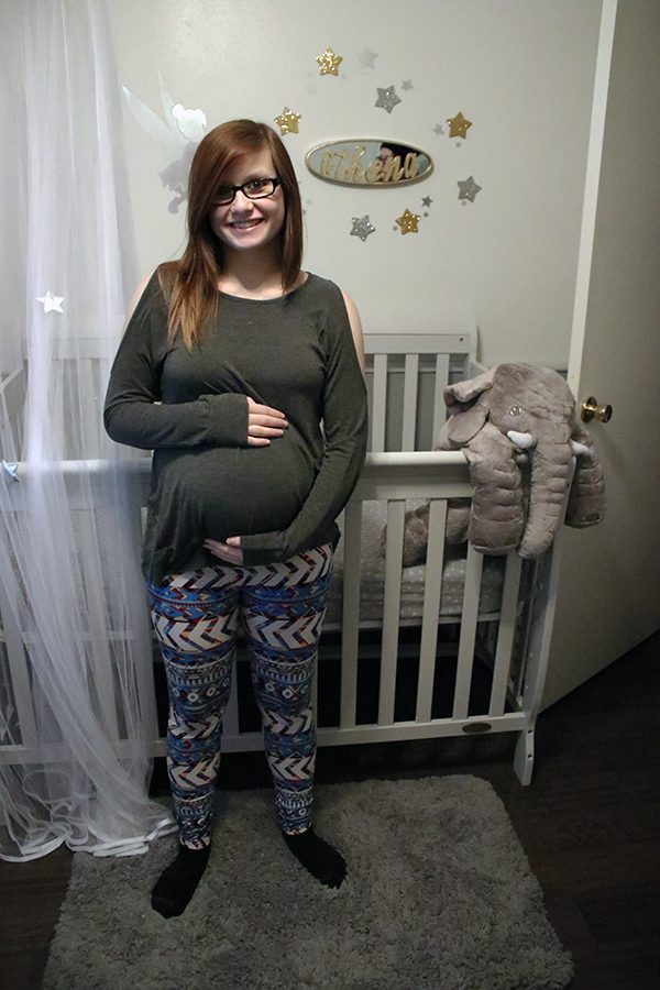 Junior Autumn Brinker in the nursery for her baby, Athena, to be born in March. 