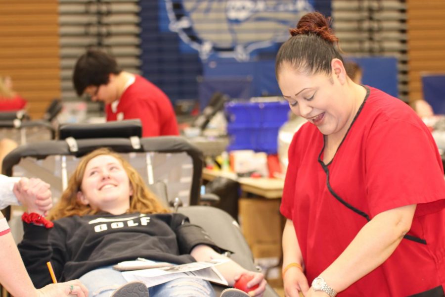 Sophomore Josie Keck gets blood taken for the first time but has the moral support of her sister Leela Keck.