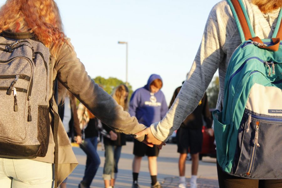 Students praying at See You At The Pole taking place earlier this year.