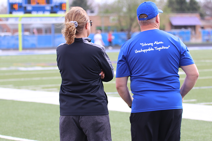 NPHS Coaches, Sarah Kaminski and Brian Jahnke, are positively influenced by their athletes during practices, games, and meets. Photo by Gracia Lantis