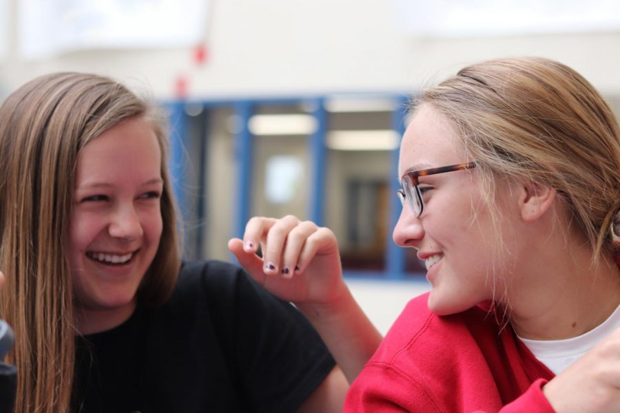 Freshmen Gracelyn Cauffman and Shelby Yoshida share a laugh during their lunch. Photo by Sophia Chingren.