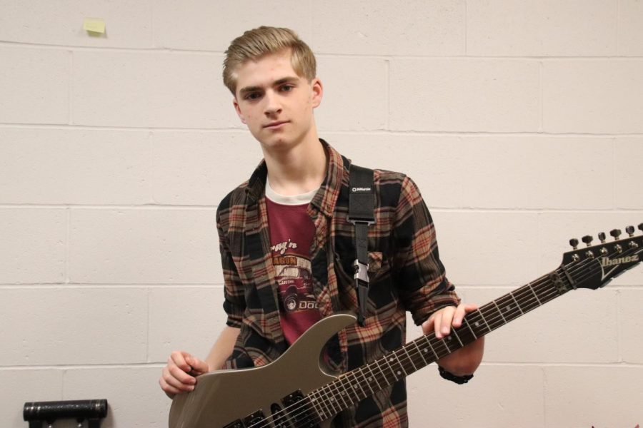 NPHS+Freshman+Jack+Bunger+poses+for+a+photo+with+his+Ibanez+guitar.