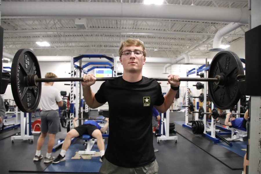 Senior Carsten Brady lifting in the weights room. To prepare for the military, Brady is trying to build up his strength and endurance. I want to do more workouts that are required to be able to keep going and not give up, he said. 