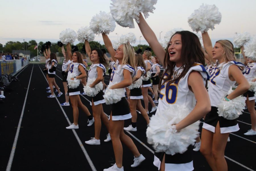 Cheerleaders encourage the football team during their annual homecoming game. The game took place on September 13th. Football player Zayden Guenin said, We cant even hear them while we are playing.