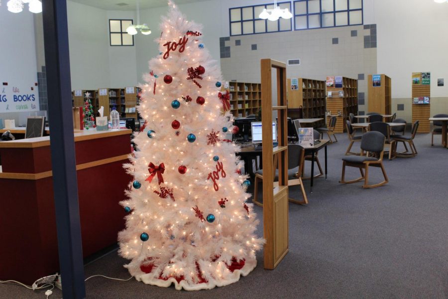 NPHS+librarians+set+up+decorations.+They+had+up+too+four+trees+in+the+library.+There+were+also+elves+hidden+in+the+books.