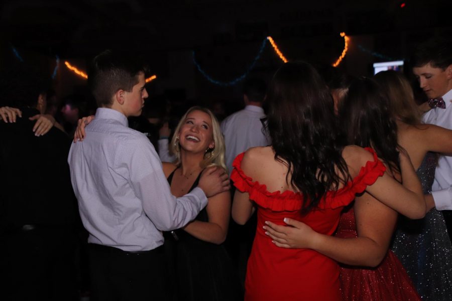 A group of couples dance to slow song at the 2020 snowball dance.