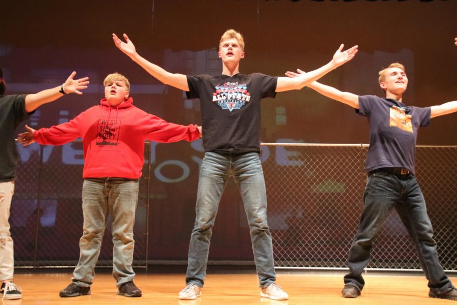 Freshman Uriel  Wiezorek, sophomore Cade Davis, senior Joel Bradley, and junior Caedmon Hoaglund practice “The Jet Song” for “West Side Story.” The musical premiers on Mar. 13, 14, and 15. The musical is being choregraphed by senior Ciera Carlson.