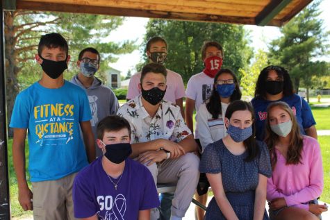 North Platte Bulldogger staff poses for a picture on the first day while wearing masks.