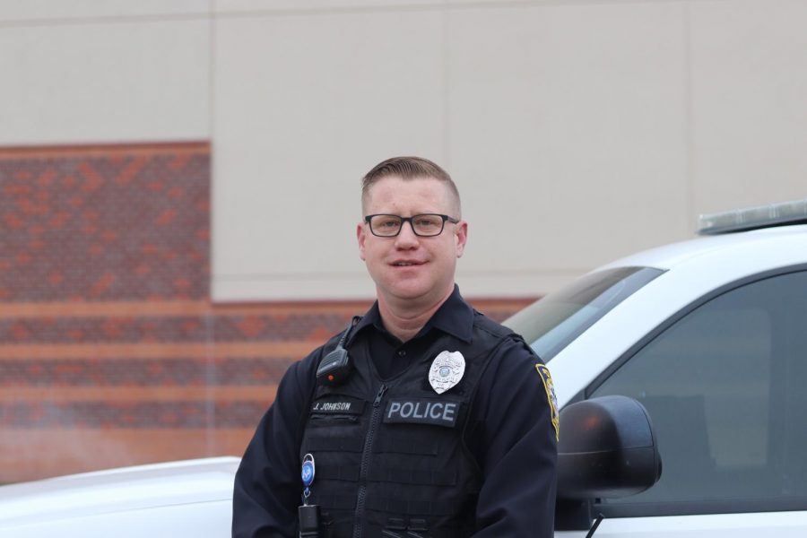 School Resource Officer Jeremiah Johnson poses in front of his police car on Monday, March 22nd. 
