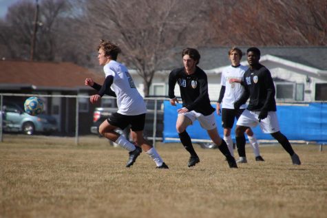 Junior Ty Hilderbrand runs after the ball during their match against Lincoln Southeast on March 18th.
