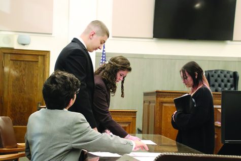 Mock Trial members from left David Grandel, Drue Huntsman, Sawyer Davis-Magnuson and Brianna Romero prepare for their trial.
