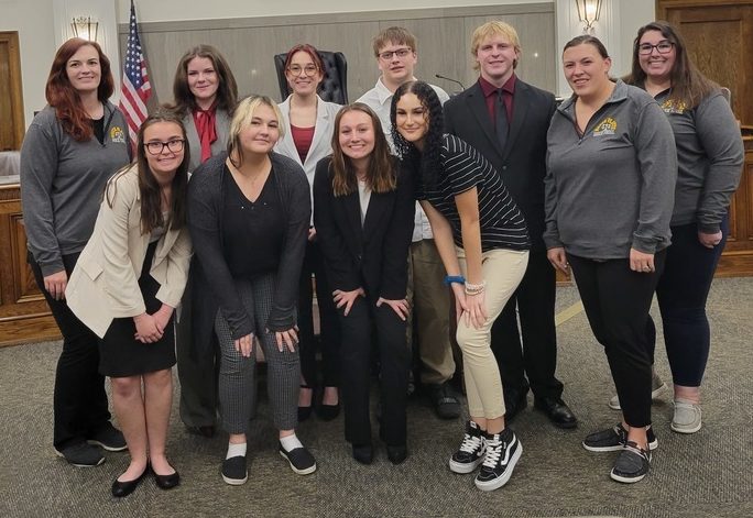 The NPHS Mock Trial team poses after winning districts. 