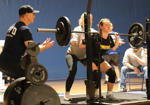 Senior Abigail Dimmitt performs in the squat at the home powerlifting meet at NPHS on Feb. 3.